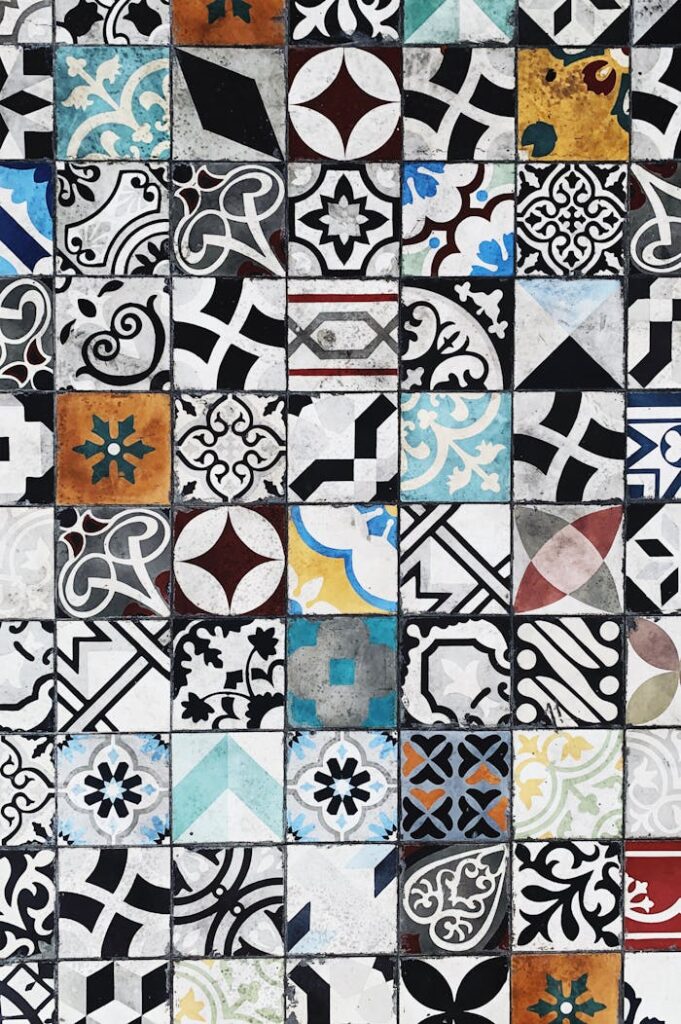 Detailed mosaic of colorful and patterned ceramic tiles in diverse geometric designs.